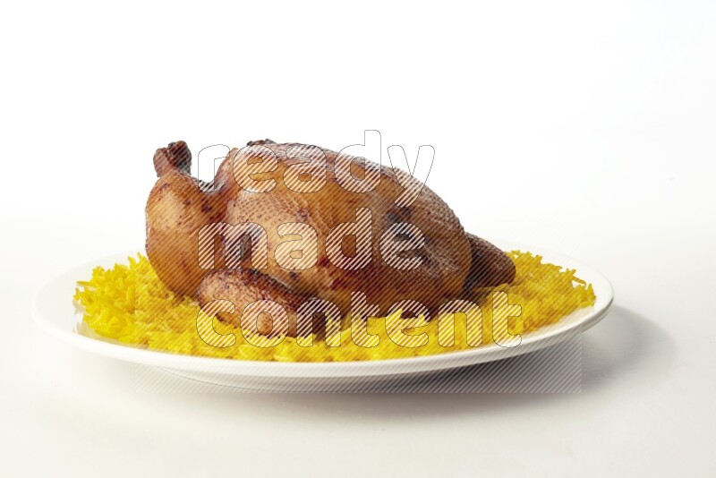 yellow  basmati Rice with  whole roasted chicken on a white rounded plate direct on white background