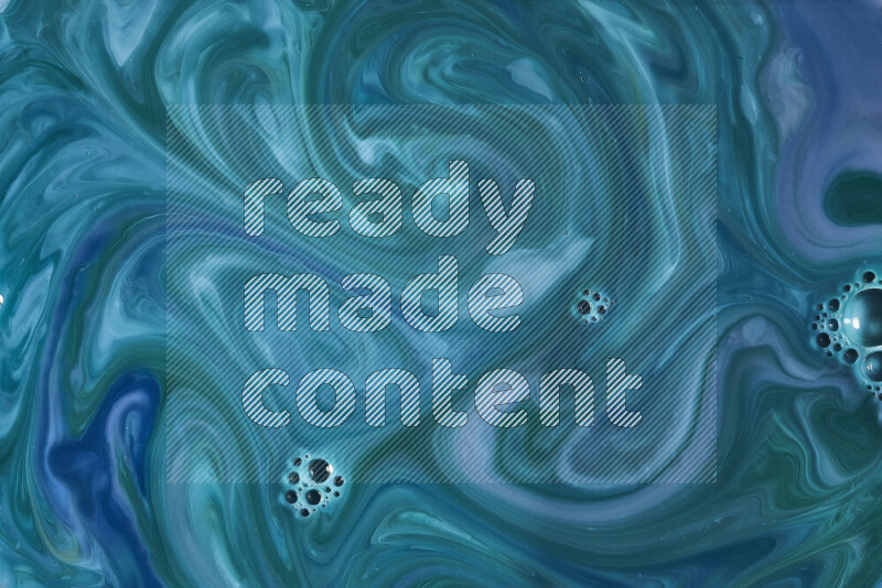 A close-up of abstract swirling patterns in blue and green