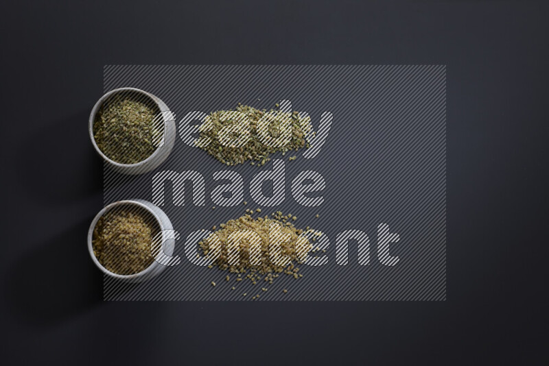 Legumes in pottery bowls on grey background