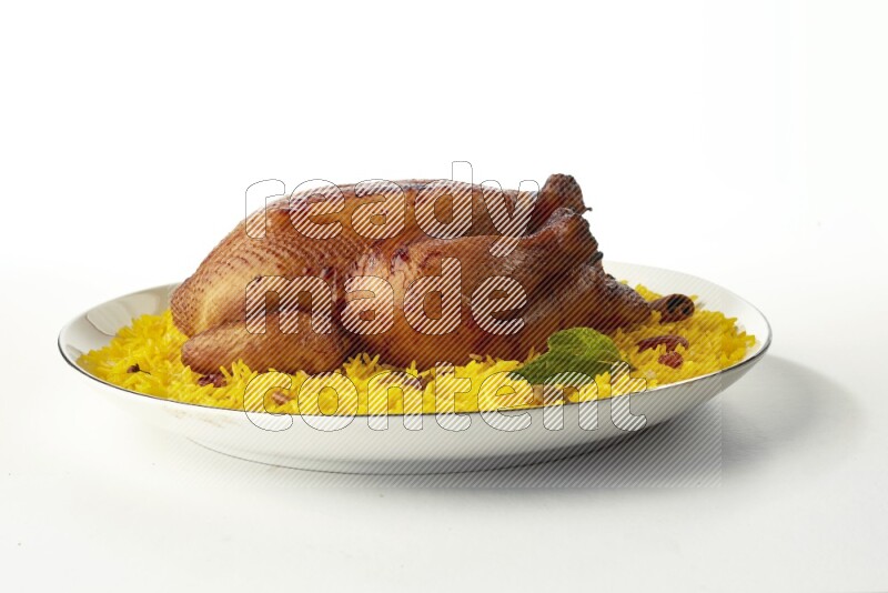 yellow  basmati Rice with kabsa chicken pieces on a white plate with a silver rim direct on white background