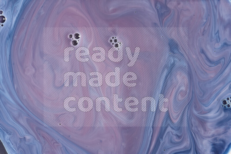 A close-up of abstract swirling patterns in blue, red and white