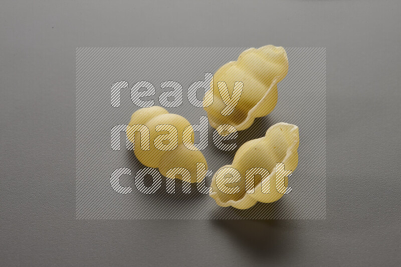 Snails pasta on grey background