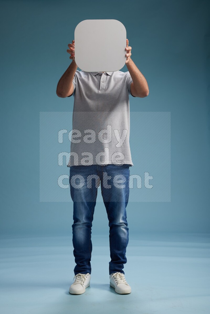 Man Standing holding social media sign on blue background