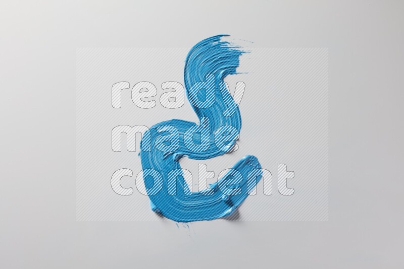 A single blue zigzag brush stroke on a white background