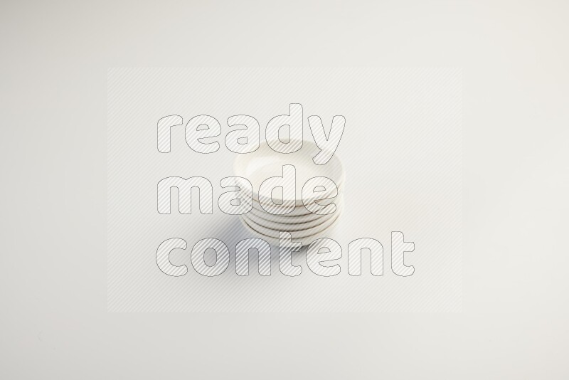 white ceramic round sauce dish on white countertop
