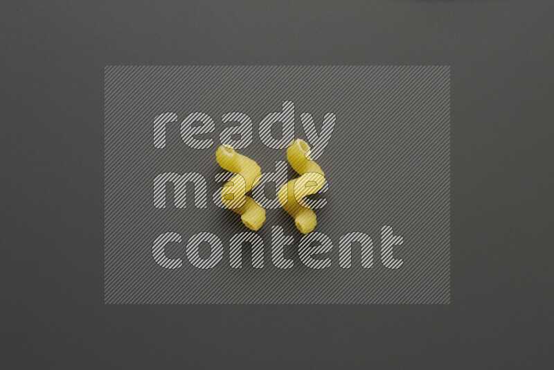 Twist pasta on grey background