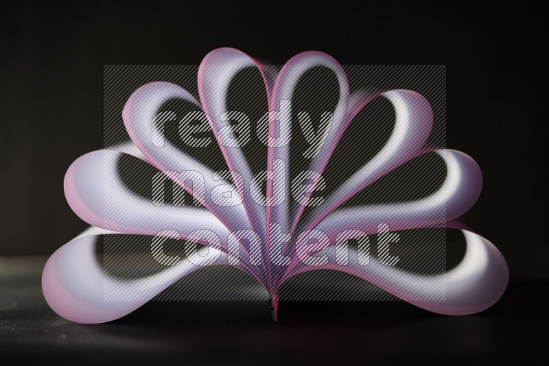 An abstract art piece displaying smooth curves in pink and white gradients created by colored light