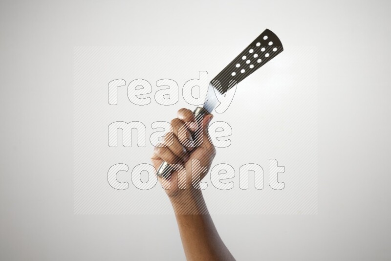 Male Hand Holding Burger Flipper on white background