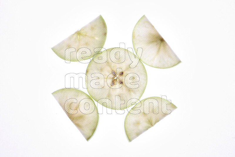 Apple slices on illuminated white background