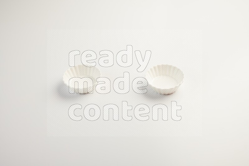 white ceramic round sauce dish on white countertop