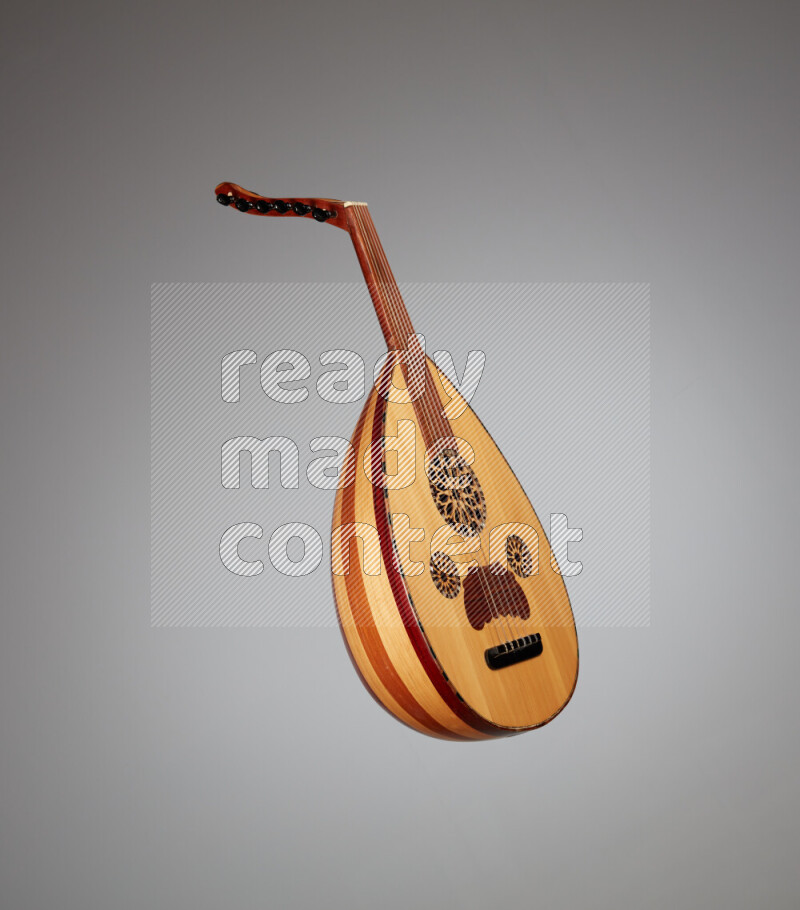 a wooden brown Oud on a gray background