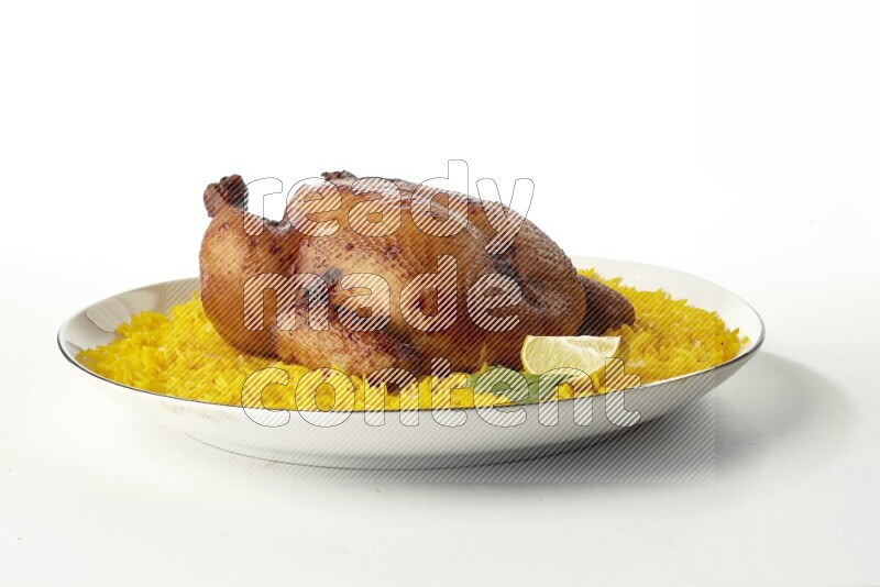 yellow  basmati Rice with kabsa chicken pieces on a white plate with a silver rim direct on white background