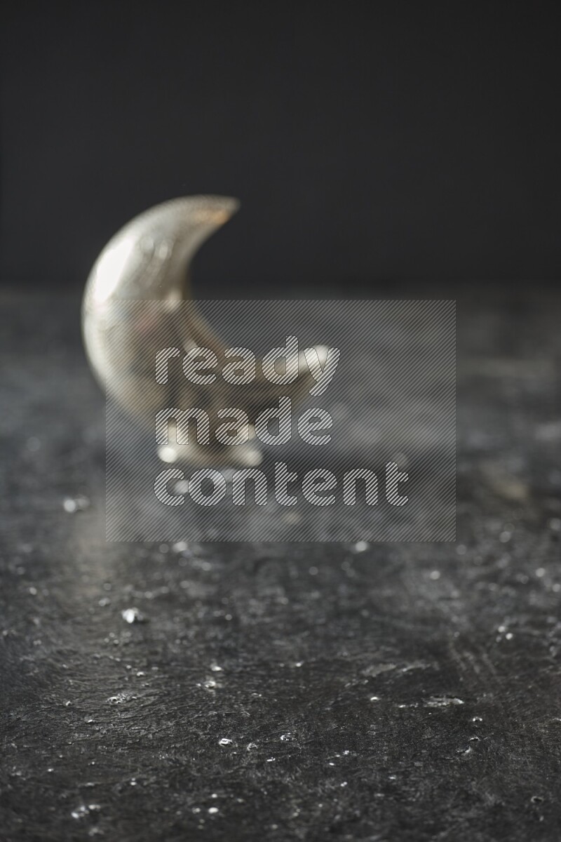 An out of focus lantern on textured black background