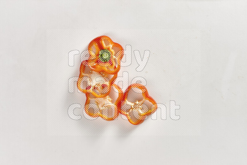 Red bell pepper slices on white background