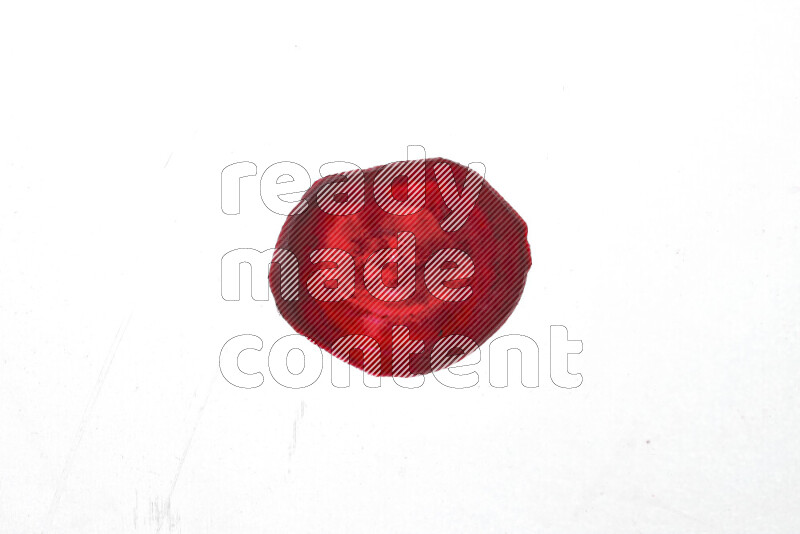 Beet slices on illuminated white background