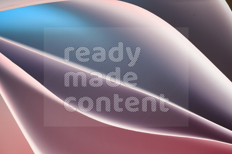 This image showcases an abstract paper art composition with paper curves in blue, purlpe and pink gradients created by colored light