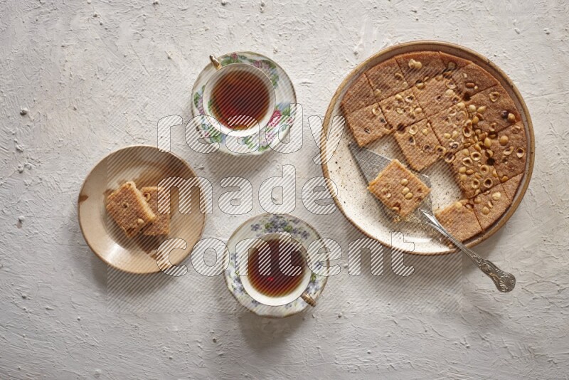 Basbousa with tea in a light setup