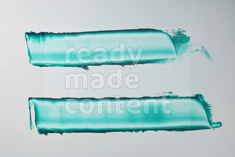 Turquoise painting knife strokes on white background