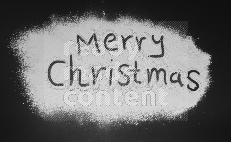 A sentence written with powder on black background