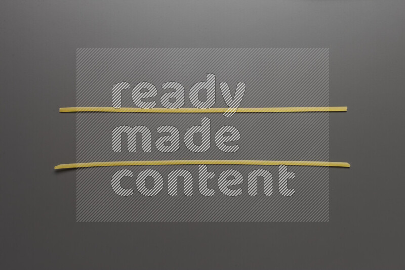 Linguini pasta on grey background