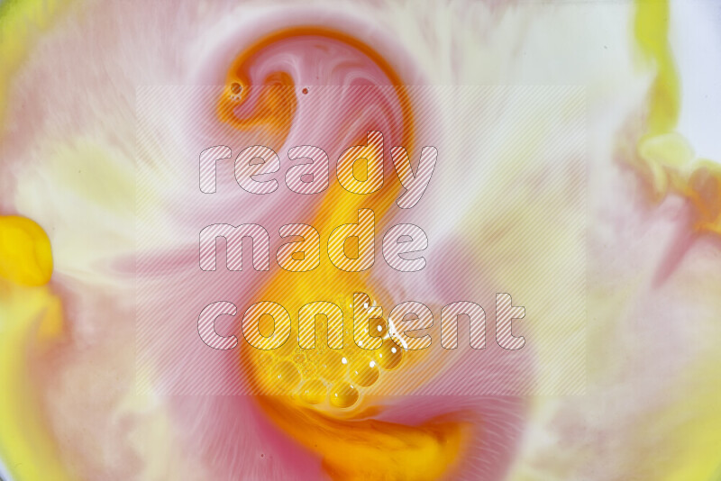 A close-up of abstract swirling patterns in orange, red and white