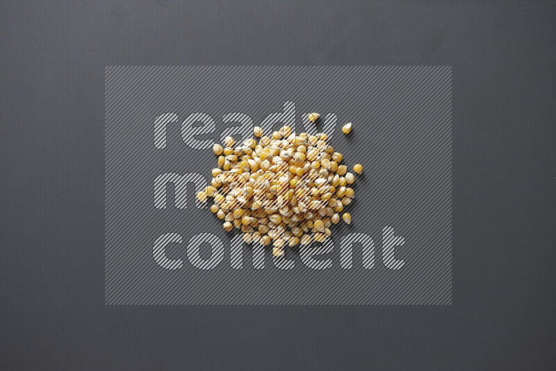 Dry corn kernels on grey background