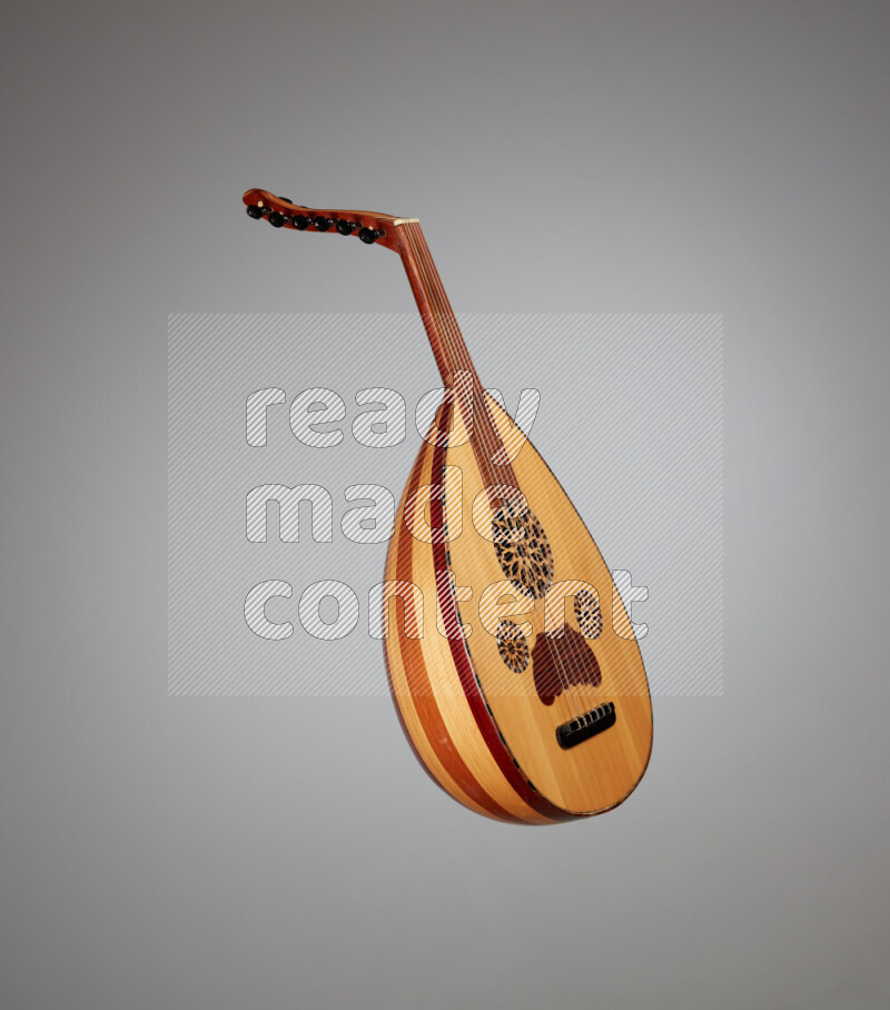 a wooden brown Oud on a gray background