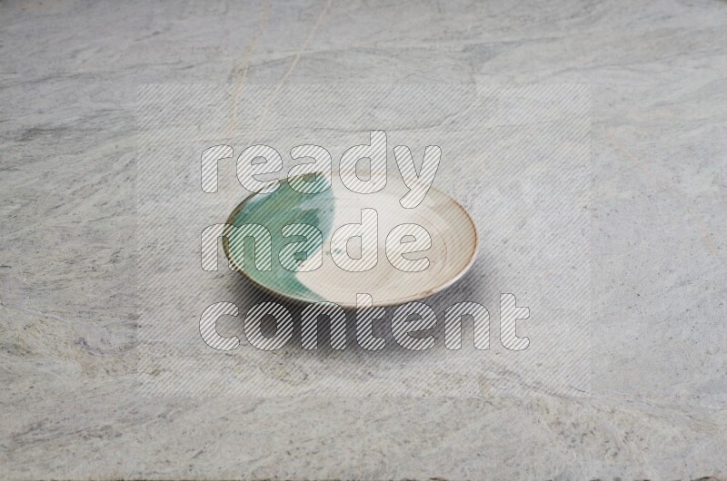 Decorative Pottery Plate On Grey Marble Flooring