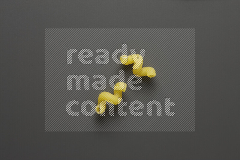 Twist pasta on grey background