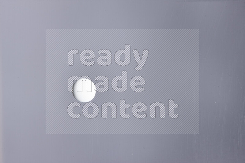 Close-ups of abstract white paint droplets on the surface