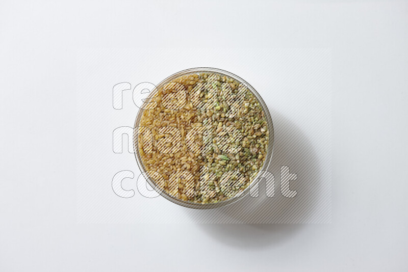 Coarse bulgur with freekeh on white background