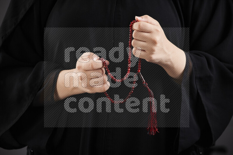 Woman hands holding praying beads (sebha) in different positions