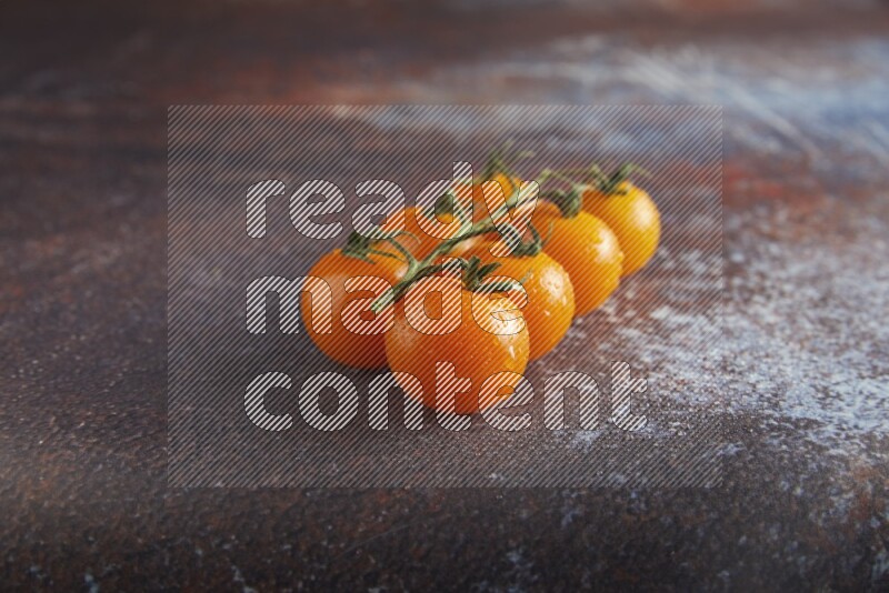 Orange cherry tomato vein on reddish rustic metal background 45 degree