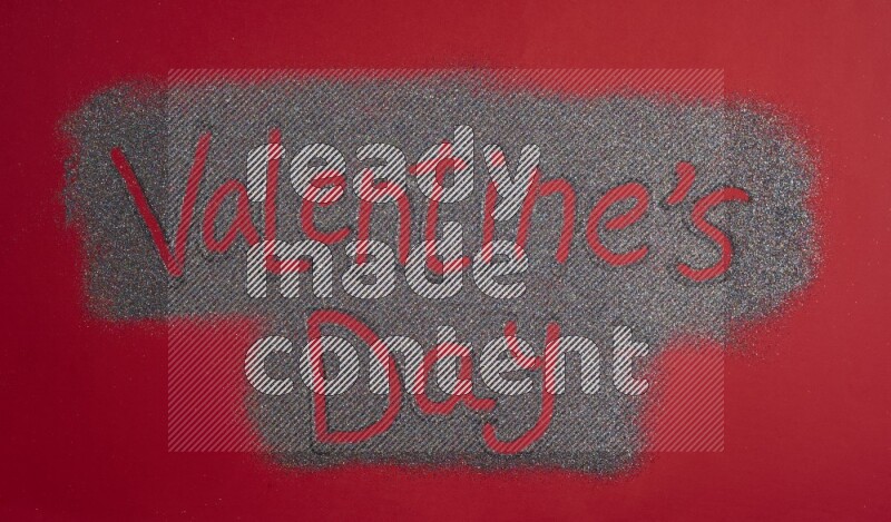 A sentence written with glitter on red background
