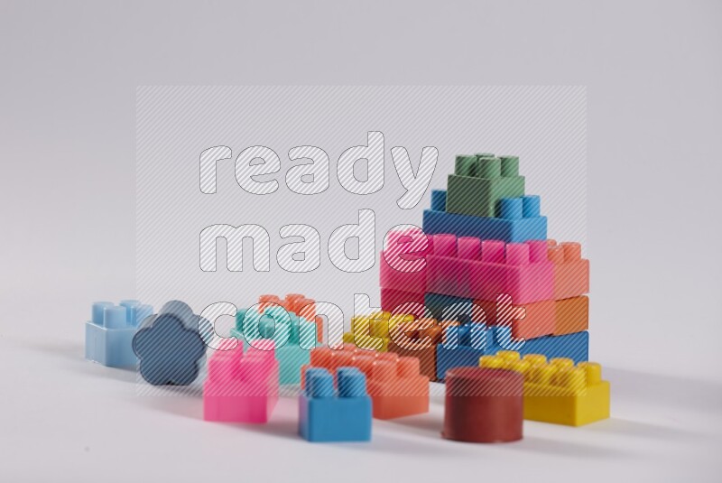 Collection of colorful different kids toys on white background