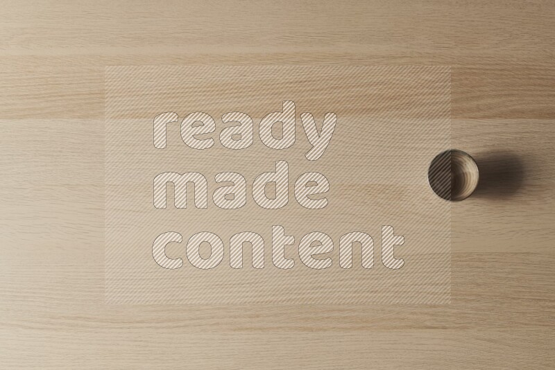 A pottery cup on light wooden background