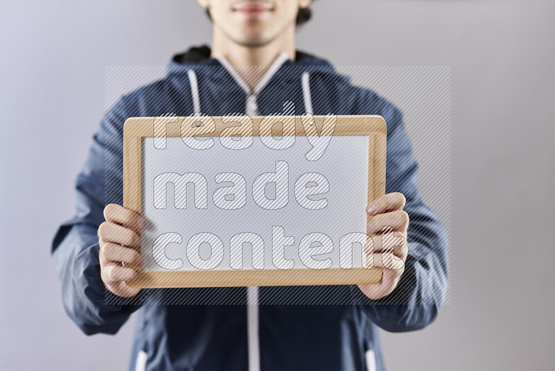 Man holding books and a board in different positions (back to school)