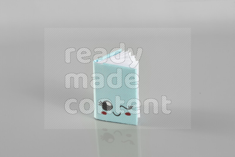 Origami book on grey background