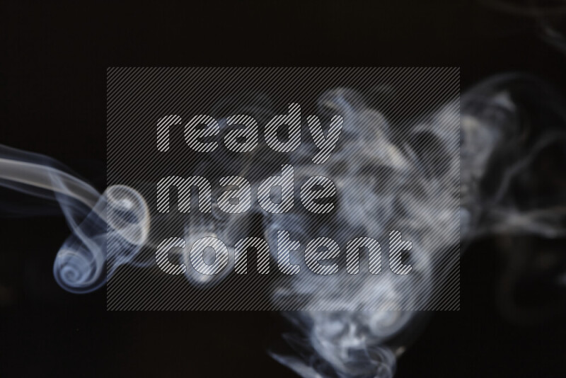 Motion of wavy smoke isolated on dark background