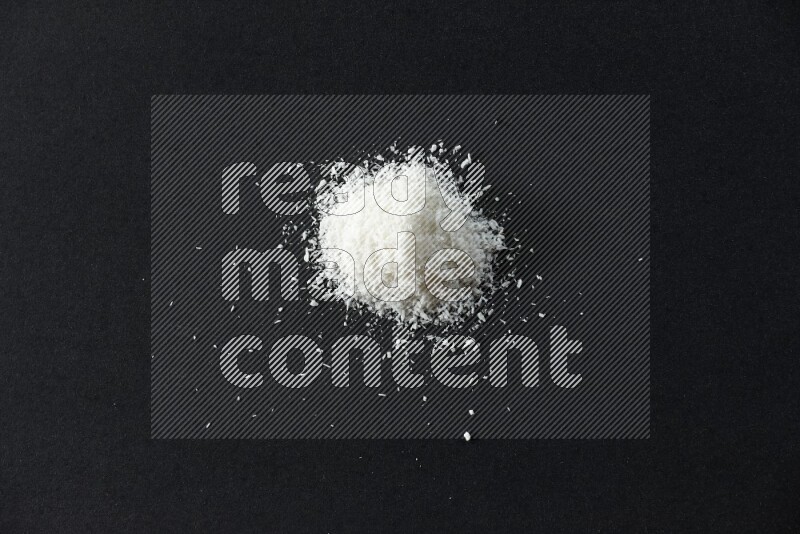 Desiccated coconut on a black background in different angles