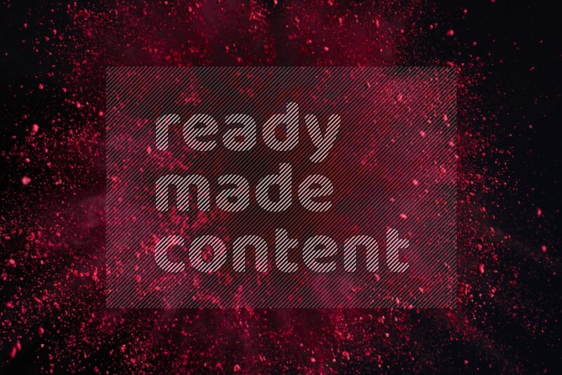 Red powder explosion on black background