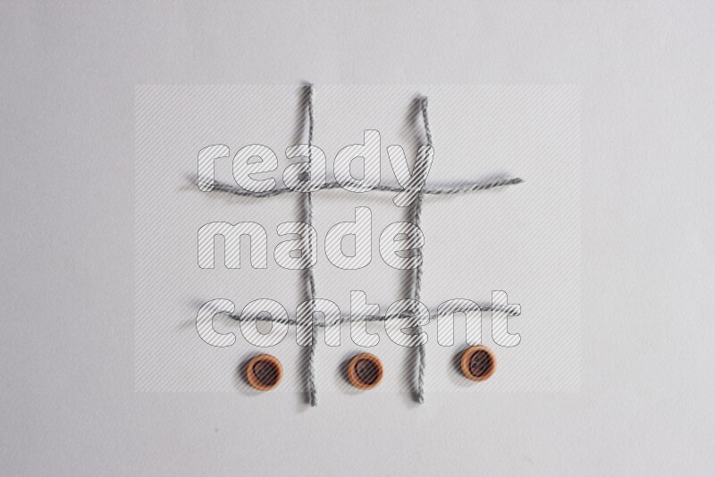 Wooden buttons placed on grey background