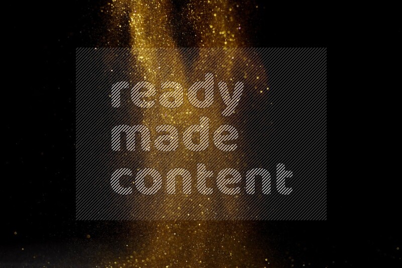 Gold glitter powder isolated on black background