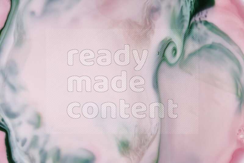 A close-up of abstract swirling patterns in red and green