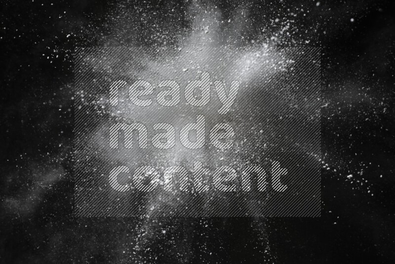 White powder explosion on black background