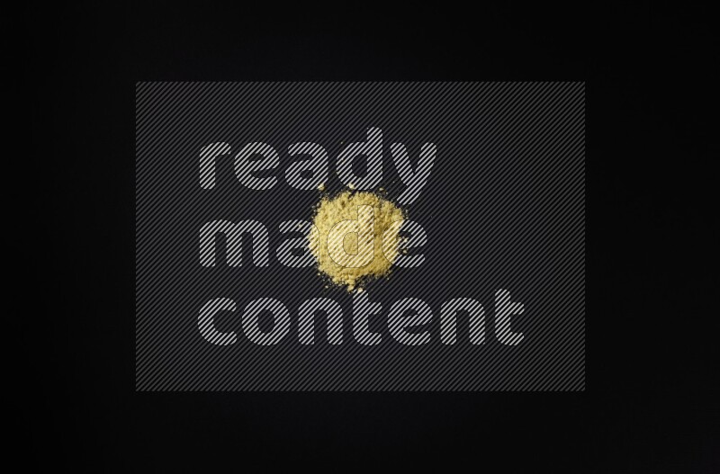 Yellow powder on black background