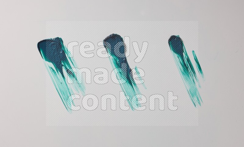 Turquoise painting knife strokes on white background