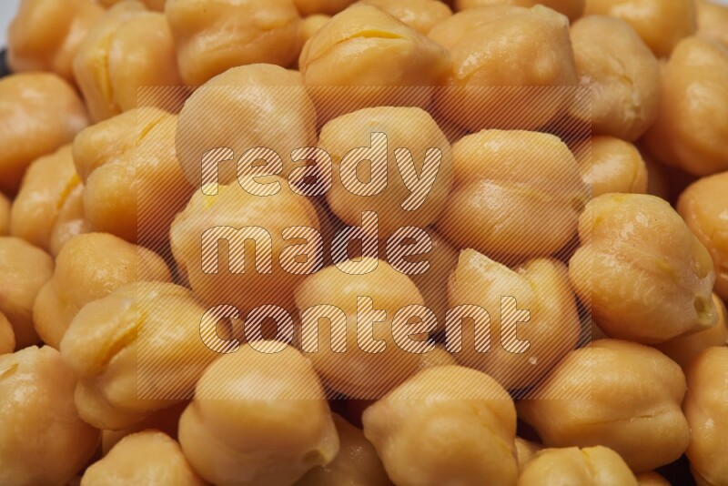 Close up shot of boiled chickpeas on white background