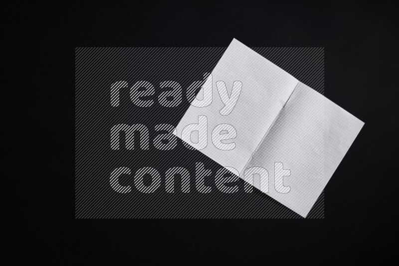 Notebook sheet on black background