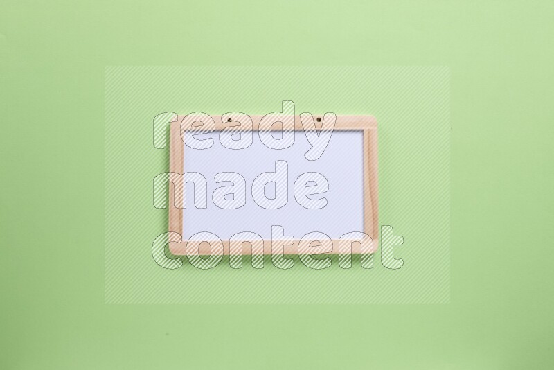 A whiteboard on green background